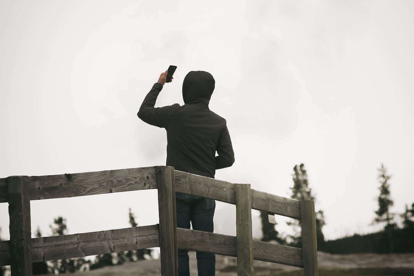 A man taking a selfie outdoors